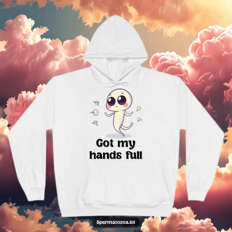 Funny sperm cell hoodie with googly eyes juggling tiny sperm cells via tail, ideal for cozy, humorous science enthusiasts.